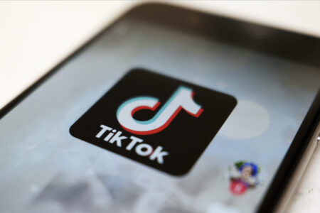 FILE - The TikTok logo is displayed on a smartphone screen, Sept. 28, 2020, in Tokyo. A federal judge is scheduled to hear arguments Thursday, Oct. 12, 2023, in a case filed by TikTok and five Montana content creators who want the court to block the state’s ban on the video sharing app before it takes effect Jan. 1. (AP Photo/Kiichiro Sato, File)