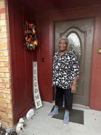 Vesser Morgan stands in front of her home in Missouri City.