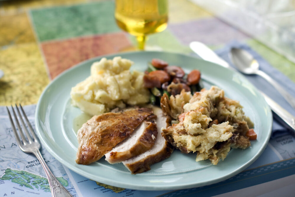 FILE - A plate of roasted turkey and gravy, stuffing, mashed potatoes, and glazed carrots appears in Concord, N.H., on Oct. 2, 2012. The Associated Press-NORC Center for Public Affairs Research looks at the state of the country's Thanksgiving favorites. 