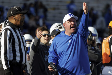 Duke head coach Mike Elko points at the video replay board after a holding penalty was called against his team during the second half of an NCAA college football game against Pittsburgh in Durham, N.C., Saturday, Nov. 25, 2023.