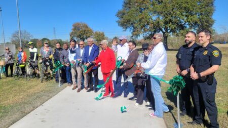 Officials hold a ribbon cutting ceremony for Sims Bayou.