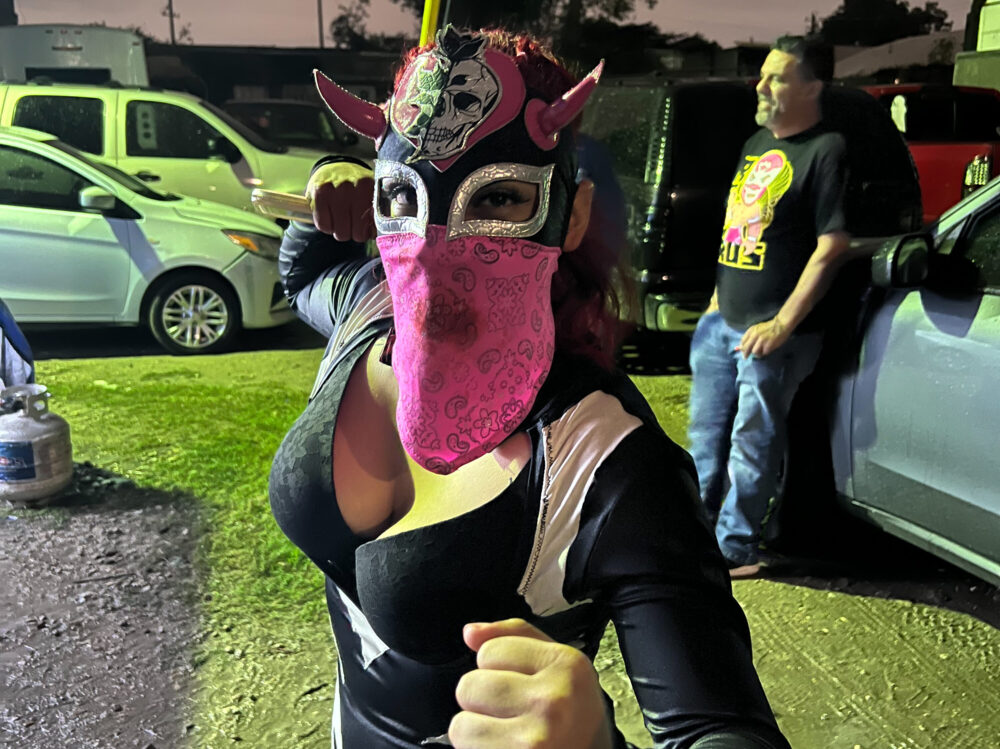 A Houston wrestler who performs under the name L.A. Spooky poses outside Coliseo Houston.