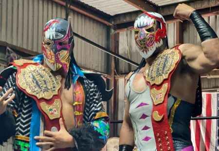 Masked wrestlers pose before a lucha libre match in Houston