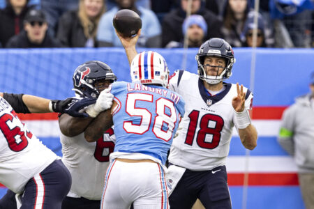 Texans quarterback Case Keenum throws a pass during the team's overtime win against the Tennessee Titans, who were wearing throwback Houston Oilers jerseys on Sunday.