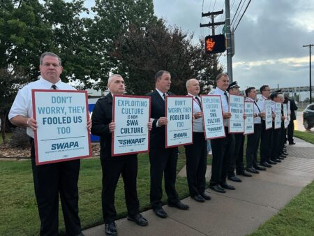 Pilots with the Southwest Airlines Pilots Association hold an informational picket outside the carrier's headquarters in Dallas on October 26, 2023.