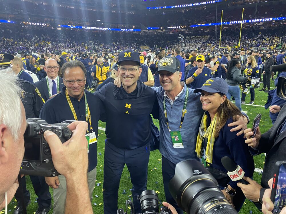 Coach Jim Harbaugh and his brother after win CFP title