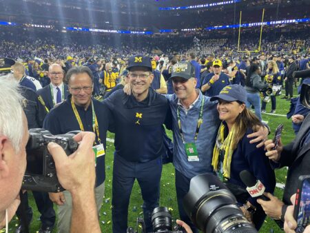 Coach Jim Harbaugh and his brother after win CFP title