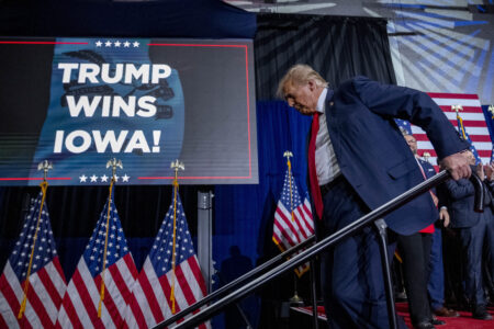 Republican presidential candidate former President Donald Trump departs a caucus night party in Des Moines, Iowa, Monday, Jan. 15, 2024. (AP Photo/Andrew Harnik)