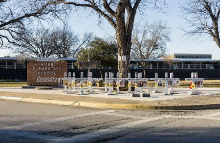 Memorial crosses outside Robb Elementary School in Uvalde on Jan. 18, 2024. The now-closed school was the site of the May 2022 mass shooting that left 19 children and two teachers dead.
