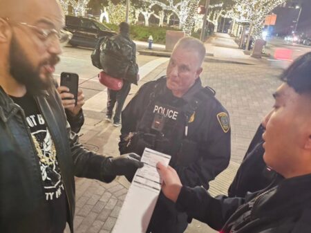 FILE: A member of Food Not Bombs received a citation for feeding the homeless on Dec. 20, 2023. 