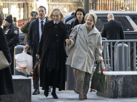 E. Jean Carroll (C) arrives for her civil defamation trial against former US President Donald Trump at Manhattan Federal Court in New York City on January 22, 2024. Former magazine columnist E. Jean Carroll claims Trump sexually assaulted her in 1995. (Photo by ANGELA WEISS / AFP) (Photo by ANGELA WEISS/AFP via Getty Images)