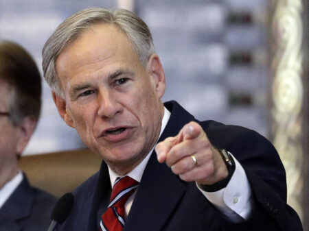 FILE - In this Feb. 5, 2019, file photo, Texas Gov. Greg Abbott gives his State of the State Address in the House Chamber in Austin, Texas. Texas lawmakers have given final approval to allowing people carry handguns without a license, and the background check and training that go with it. The Republican-dominated Legislature approved the measure Monday, May 24, 2021 sending it to Gov. Abbott. (AP Photo/Eric Gay, File)