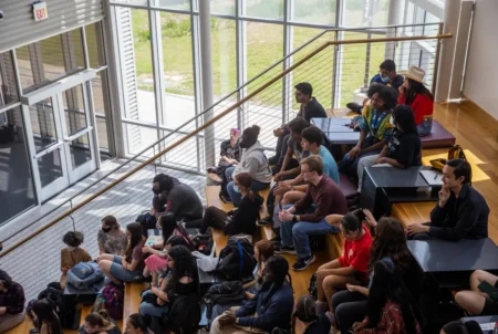 Early College High school juniors listen to a presentation on college applications at the Austin Community College's Round Rock campus on May 5, 2023.