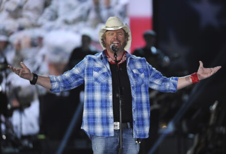 FILE - In this April 7, 2014, file photo shows Toby Keith performs at ACM Presents an All-Star Salute to the Troops in Las Vegas. “Beer For My Horses” singer-songwriter Toby Keith has died. He was 62.  Keith passed peacefully on Monday, Feb. 5, 2024 surrounded by his family, according to a statement posted on the country singer's website.(Photo by Chris Pizzello/Invision/AP, File)