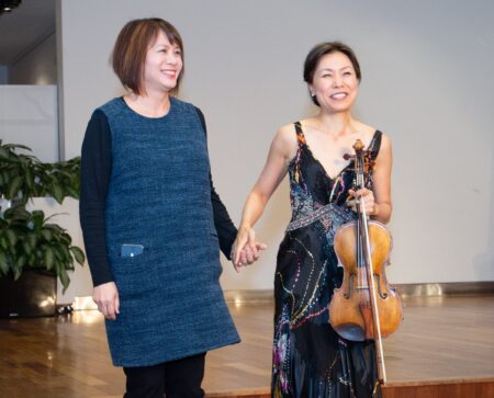 Photo of composer and violinist on stage