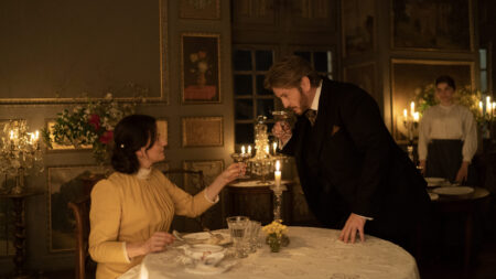Still from The Taste of Things showing characters dining