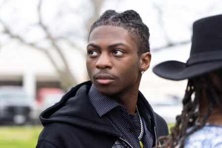 Darryl George, an 18-year-old junior at Barbers Hill High School, stands near his mother before a bench trial on Thursday over whether his repeated suspensions violate the CROWN Act. Taken on Feb. 22, 2024.  