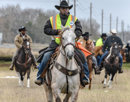 Members of the Southwestern Trail Ride on their way to Houston.
