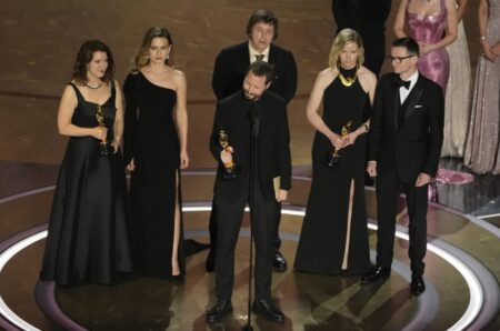 Raney Aronson-Rath, from left, Vasilisa Stepanenko, Mstyslav Chernov, Evgeniy Maloletka, Michelle Mizner, and Derl McCrudden accept the award for best documentary feature film for “20 Days in Mariupol” during the Oscars on Sunday, March 10, 2024, at the Dolby Theatre in Los Angeles. (AP Photo/Chris Pizzello)