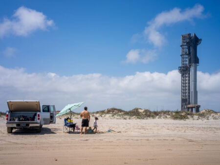 BROWNSVILLE, TEXAS - MARCH 13: A family spends time together on the shore near the Starship Flight 3 Rocket a day before its scheduled launch at the Starbase facility near Boca Chica beach on March 13, 2024 in Brownsville, Texas. SpaceX is preparing to launch its first Starship test of 2024. The operation will be SpaceX's third attempt at launching a rocket into space. If successful, the company will have achieved a historic milestone for the world's largest rocket being launched into space. (Photo by Brandon Bell/Getty Images)