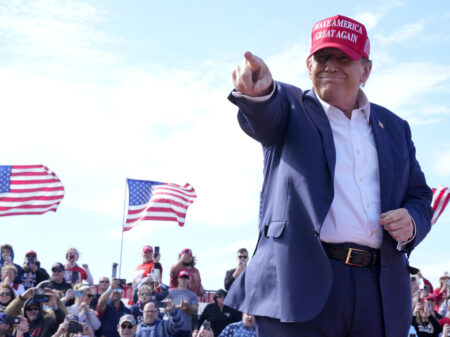 Republican presidential candidate former President Donald Trump gestures to the crowd at a campaign rally Saturday, March 16, 2024, in Vandalia, Ohio.