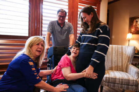 Lea Ann Capel, her husband Raimond Capel, and her daughters Cassie Weddel and Lindsey Hurt in their home Wednesday, March 13, 2024, in North Richland Hills. Cassie has lived in a group home for many years and now the family is pulling her out in part because of conditions in the home.