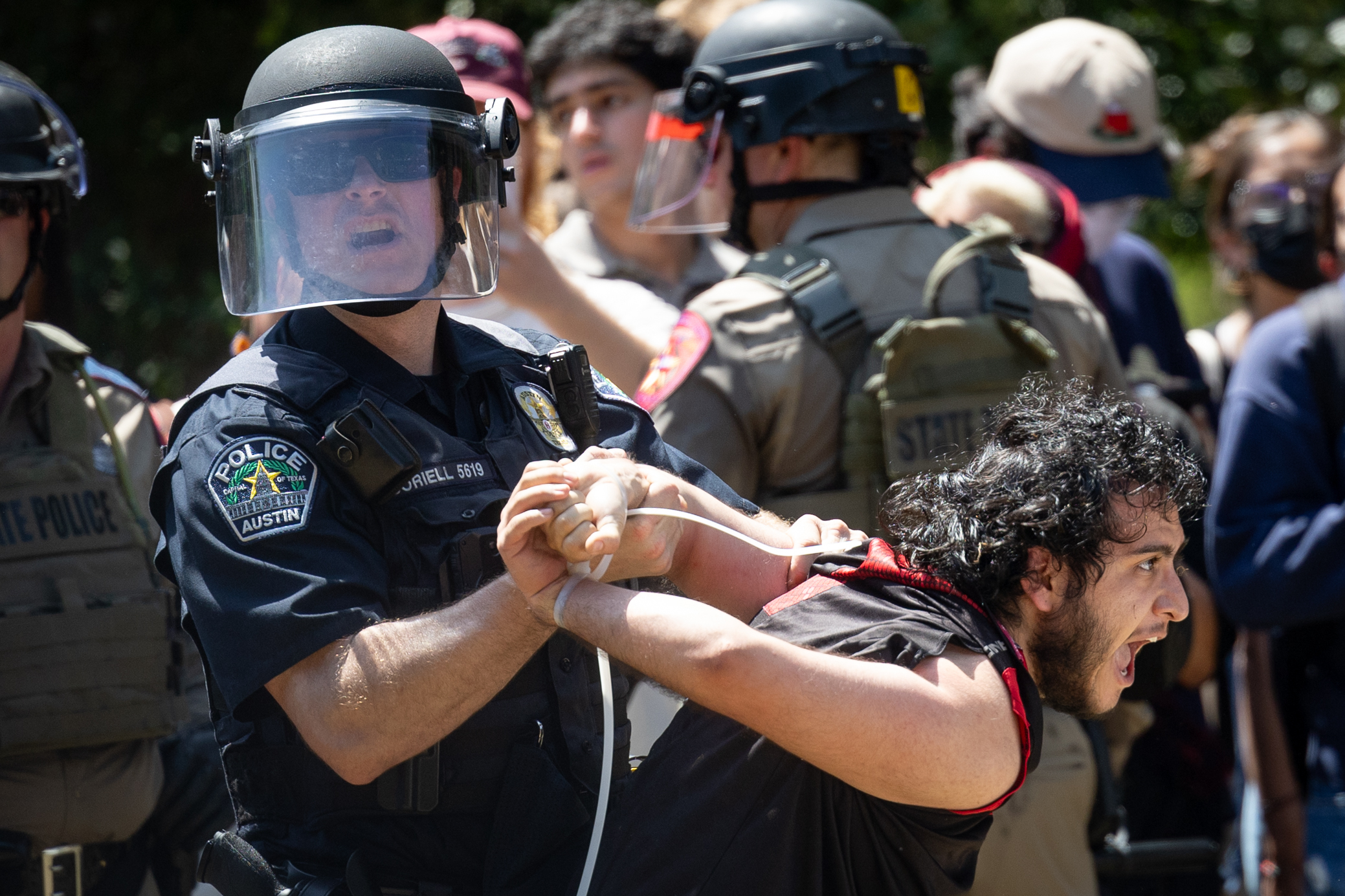 Austin police arrest a demonstrator Monday at a protest on UT Austin campus against the Israel war in Gaza.