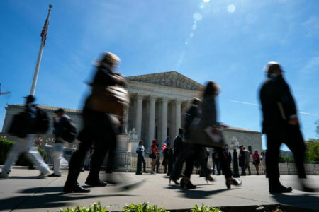 WASHINGTON, DC - APRIL 16: People walk by as supporters of January 6 defendants including Micki Witthoeft, the mother of Ashli Babbitt, who was killed on January 6, 2021, gather outside of the Supreme Court on April 16, 2024 in Washington, DC. The Supreme Court is hearing oral arguments in Fischer v. U.S., a case about whether the U.S. Court of Appeals for the District of Columbia Circuit erred in applying a specific part of U.S. criminal code when charging January 6 defendants. (Photo by Kent Nishimura/Getty Images)