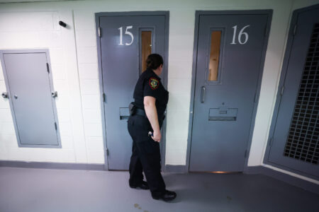 A detention officer checks cells in the general population housing Thursday, March 7, 2024, at the Tarrant County jail in Fort Worth.