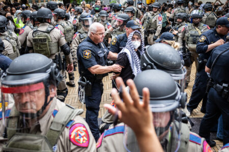 Law enforcement arrest students taking part in a pro-Palestinian walkout and protest on April 24, 2024, at the University of Texas at Austin. Michael Minasi/KUT News
