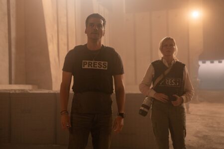 Still from Civil War movie showing Wagner Moura and Kirsten Dunst