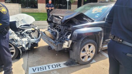 Two cars used as visuals for a press conference about a DWI initiative throughout Harris County.
