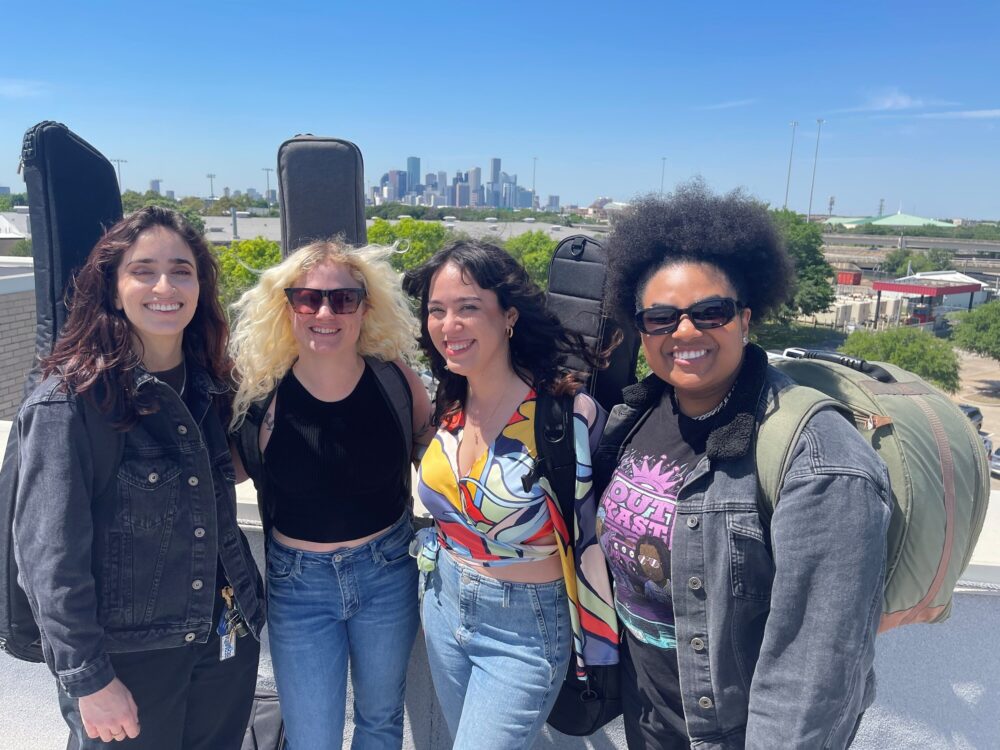 Catterina (second from right) and band members on the roof of Houston Public Media