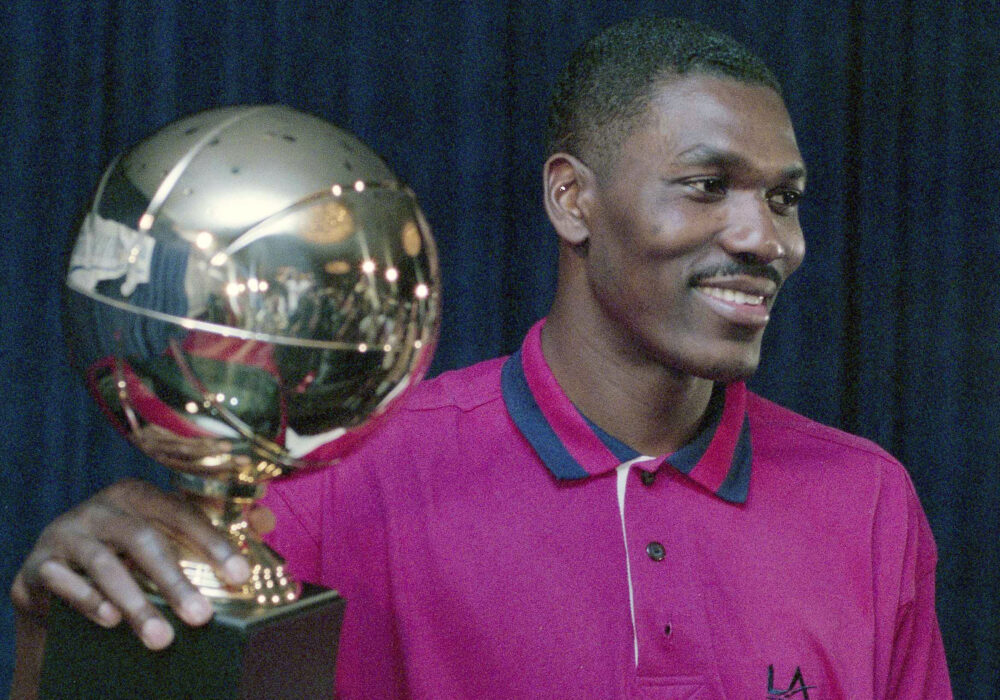 Hakeem Olajuwon with the NBA Finals MVP trophy