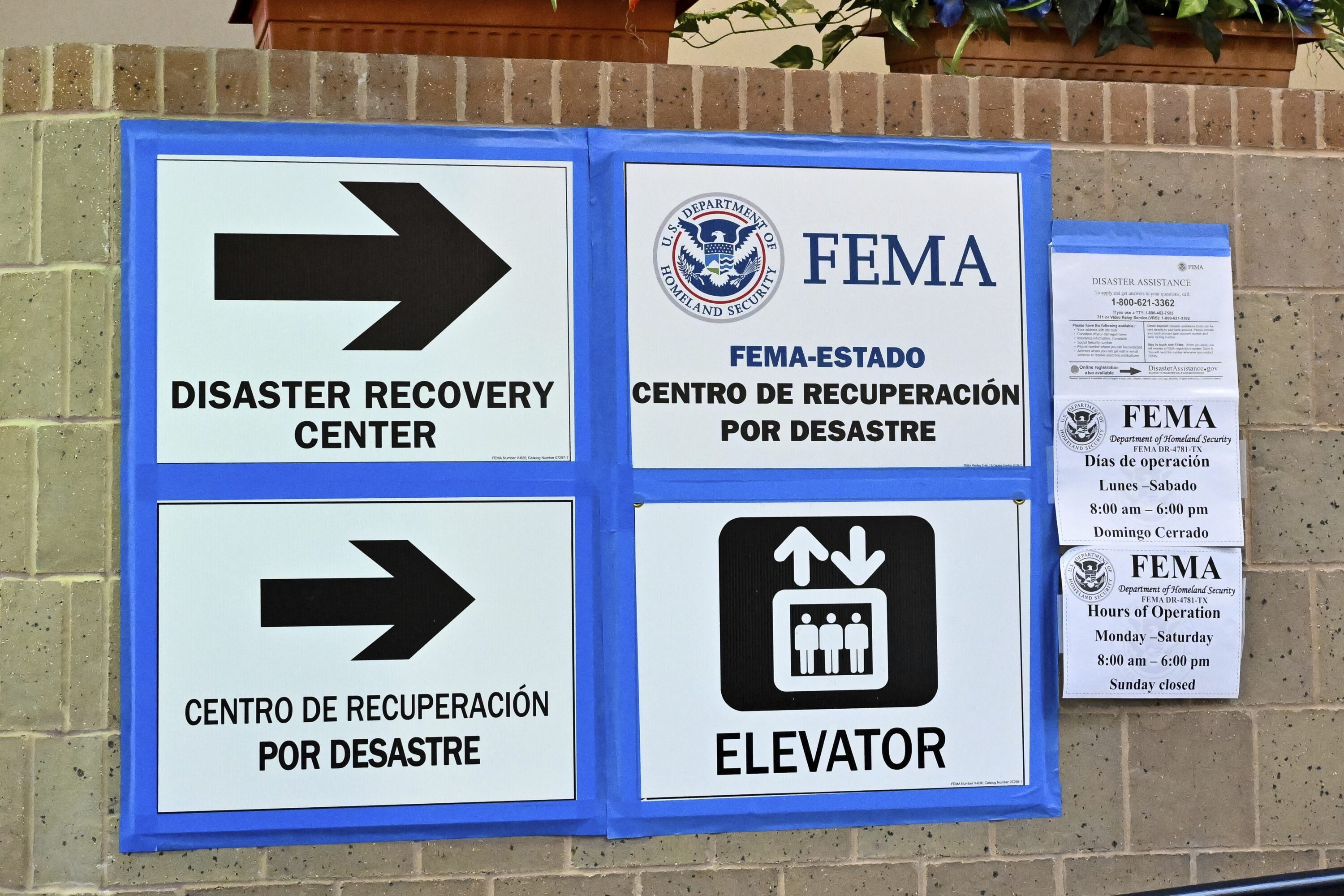 FEMA signs are seen at the cooling station at Acres Homes Community Center in Houston on Wednesday, July 10, 2024, after Hurricane Beryl hit Texas, knocking out power to millions of homes and businesses. (AP Photo/Maria Lysaker)