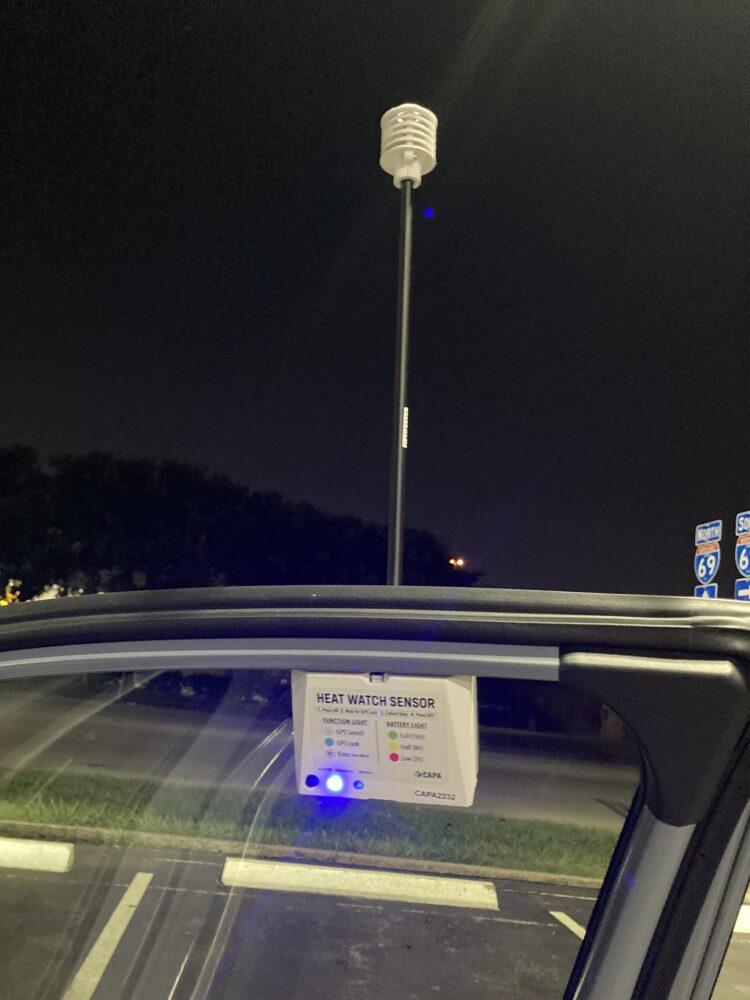 The heat watch sensor on the top of a car door. Volunteers drove around the region to record temperatures.