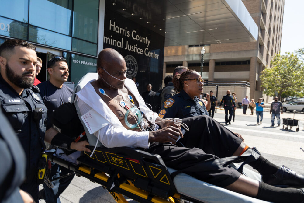 Gerald Goines on a gurney outside of the Harris County Criminal Justice Center