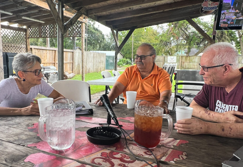 Carlos Villagomez (center) at a recent gathering at his beer garden.