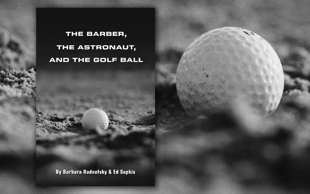 A black and white image of a golf ball