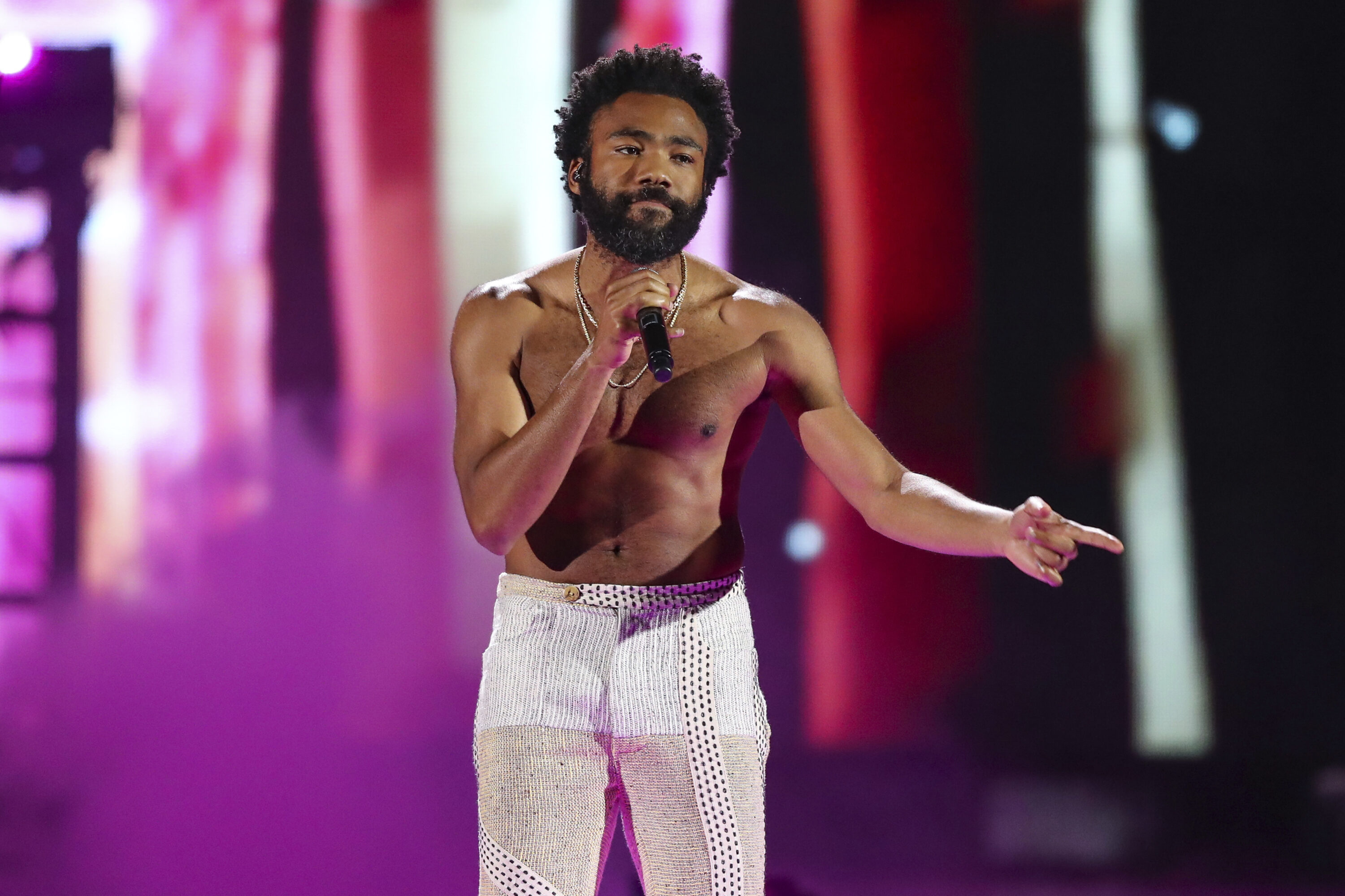 FILE - In this Friday, September 21, 2018 file photo, Childish Gambino performs during the first day of the 2018 iHeartRadio Music Festival at the T-Mobile Arena in Las Vegas. Hip-hop has been an integral part of social and racial justice movements. It has also come under scrutiny from law enforcement and political groups because of their belief that hip-hop and its artists encourage violent crime. Free speech advocates see the ongoing persecution of rappers as a proxy war waged primarily against blacks and Latinos who are the culture's first pioneers. His hit 