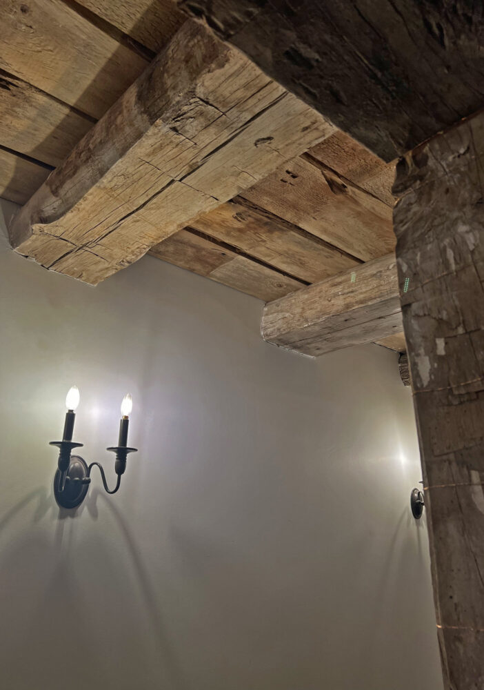 Beams and a candelabra in the barn at Beckendorff Farms. (Photo Credit: Michael Hagerty/Houston Public Media)