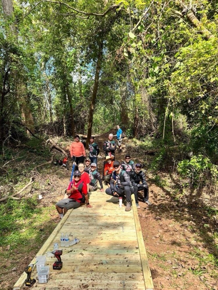 Members of the Fort Bend Mountain Bike Association pose for a photo.