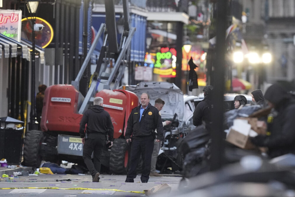 EDS NOTE: GRAPHIC CONTENT - Security personnel investigate the scene on Bourbon Street after a vehicle drove into a crowd on New Orleans' Canal and Bourbon Street, Wednesday Jan. 1, 2025. (AP Photo/Gerald Herbert) (Photo Credit: Associated Press)