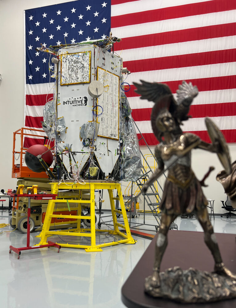 Intuitive Machines' second lunar lander next to a figure of the war goddess Athena from Homer's 