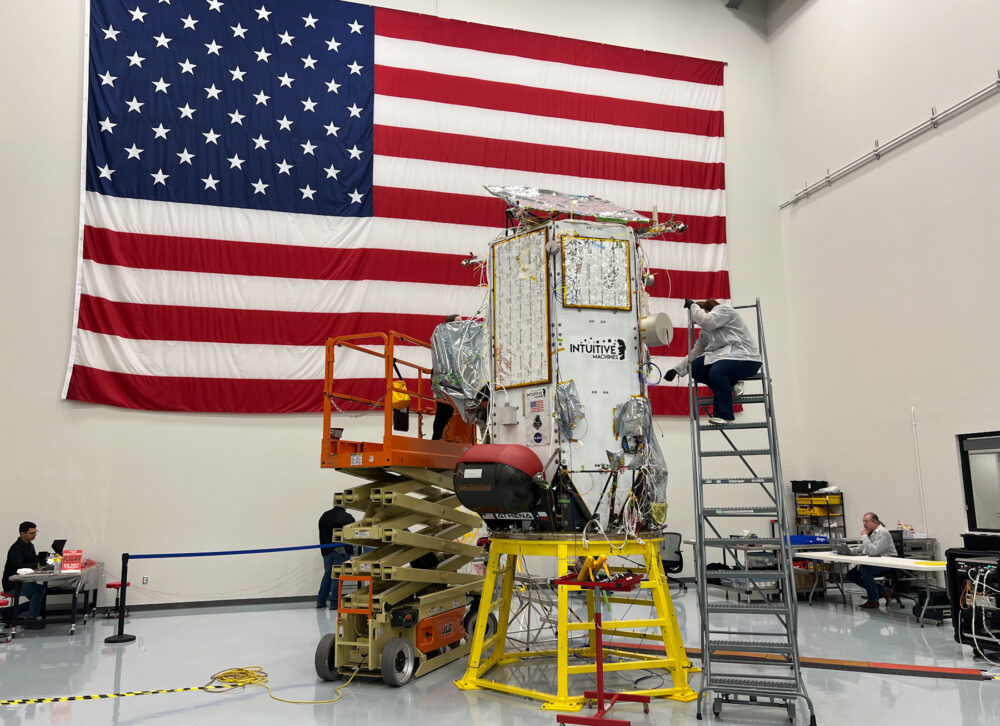 A person works on the Athena lunar lander