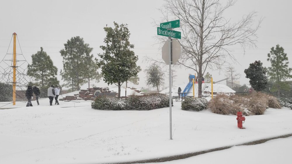 Snow blankets a playground in Baytown, Tuesday, Jan. 21, 2025. (Photo Credit: Patricia Ortiz/ Houston Public Media)