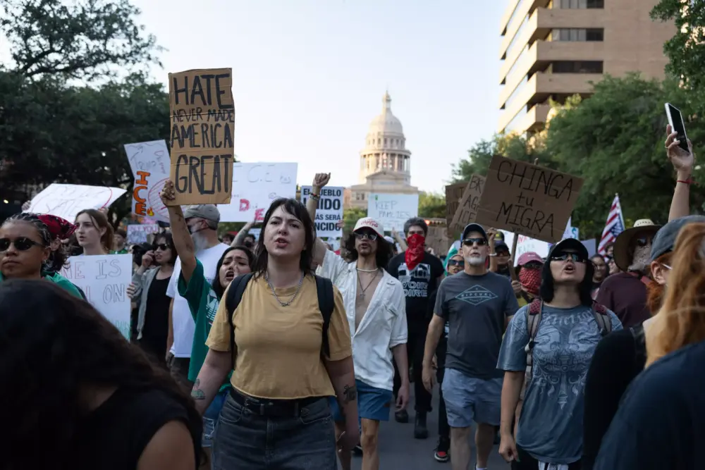 Hundreds of protestors march in downtown Austin during the ICE out of Austin protest on Monday, June, 9, 2025. Protestors are headed to the ICE building. Patricia Lim/KUT News