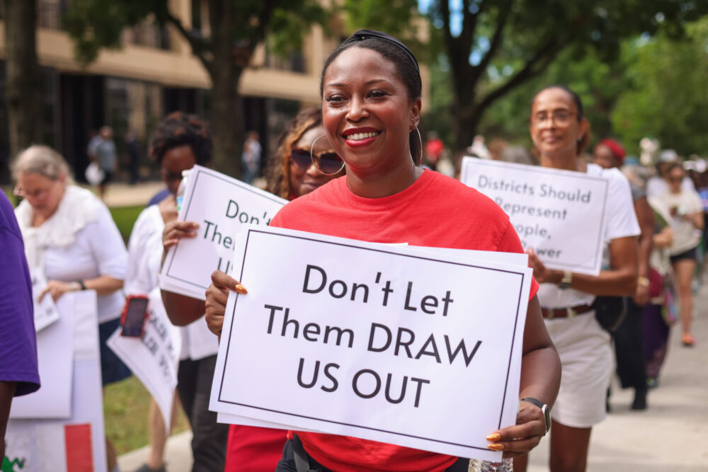 Before the hearing got underway, hundreds of demonstrators gathered for a rally in a park on the main UH campus. (Rob Salinas/Houston Public Media)