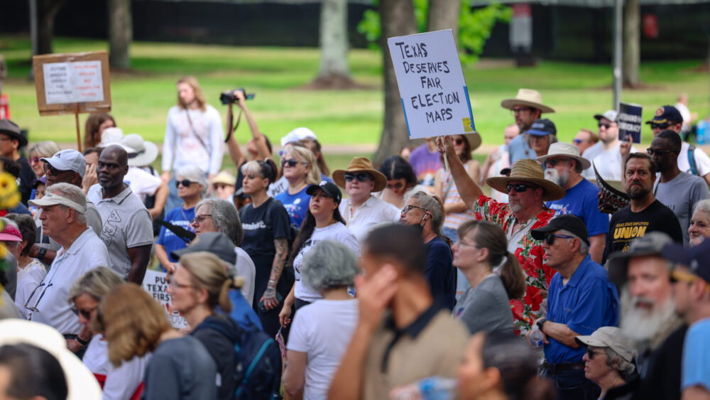 Before the hearing got underway, hundreds of demonstrators gathered for a rally in a park on the main UH campus. (Rob Salinas/Houston Public Media)