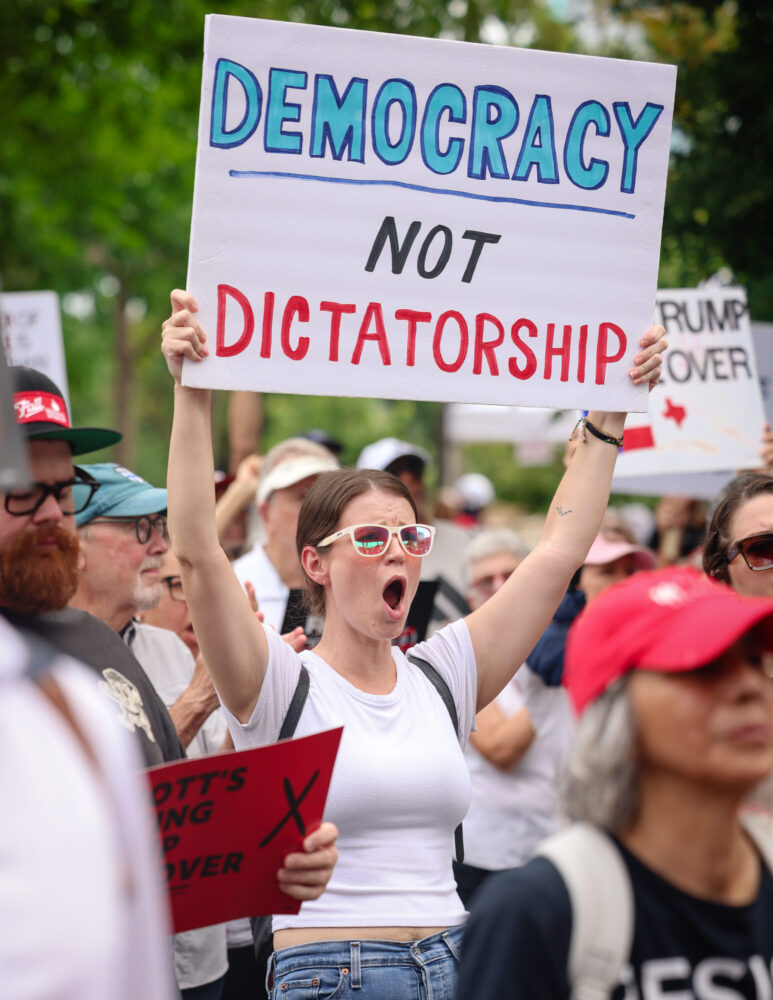 Before the hearing got underway, hundreds of demonstrators gathered for a rally in a park on the main UH campus. (Rob Salinas/Houston Public Media)
